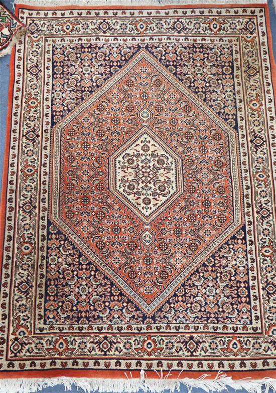 A Persian Bidjar wool rug, ivory ground with terracotta edge 93 x 127cm